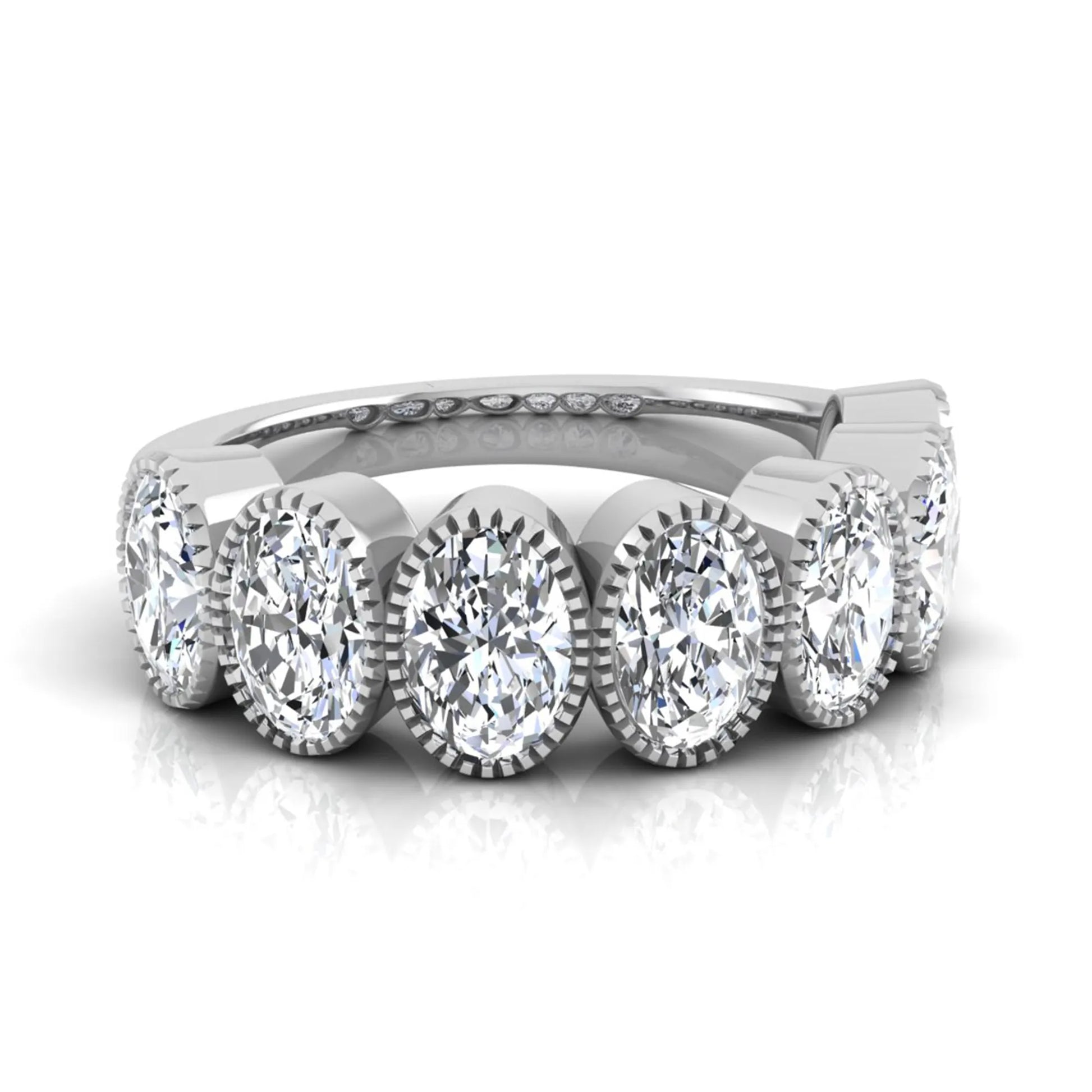 Seven Stone Oval Cut Lab Grown Diamond Band Ring featuring seven oval cut diamonds in elegant milgrain bezel-inspired settings with a white gold tone band.
