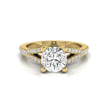 yellow-Gold ring with a large diamond and smaller diamonds on the band against a white background