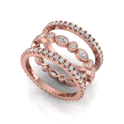 Stackable three band ring set featuring marquise and round lab grown diamonds with vintage milgrain bezels and pavé diamond bands in rose gold