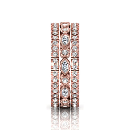 Stackable three band ring set featuring marquise and round lab grown diamonds with vintage milgrain bezels and pavé diamond bands in rose gold