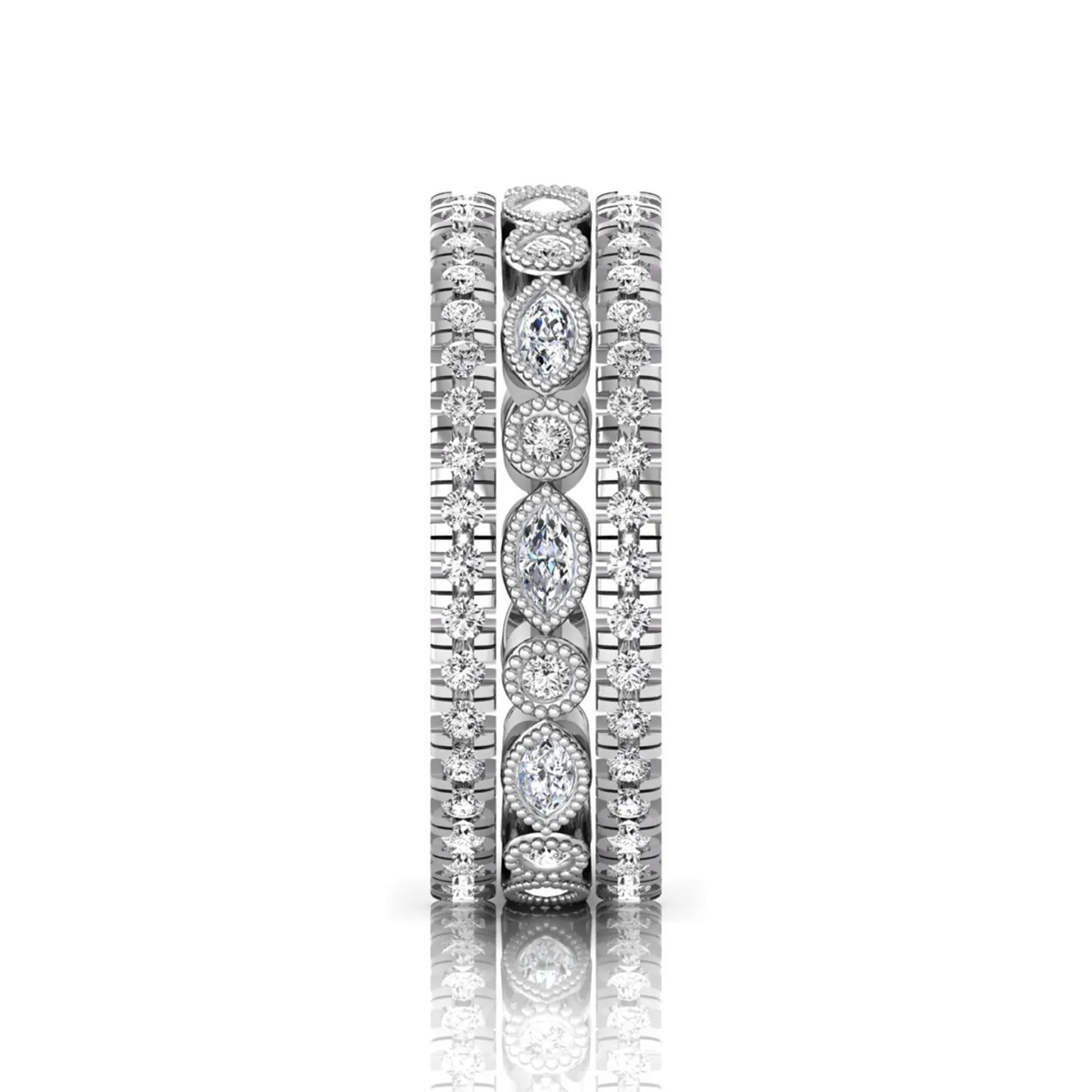 Stackable three band ring set featuring marquise and round lab grown diamonds with vintage milgrain bezels and pavé diamond bands in white gold