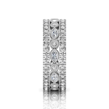 Stackable three band ring set featuring marquise and round lab grown diamonds with vintage milgrain bezels and pavé diamond bands in white gold