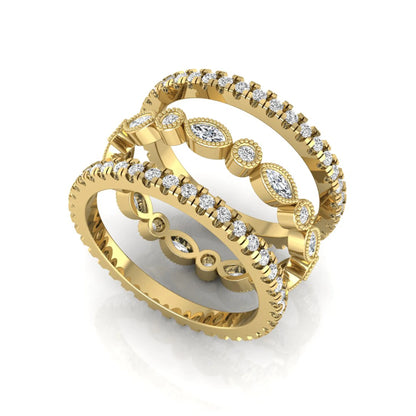 Stackable three band ring set featuring marquise and round lab grown diamonds with vintage milgrain bezels and pavé diamond bands in yellow gold