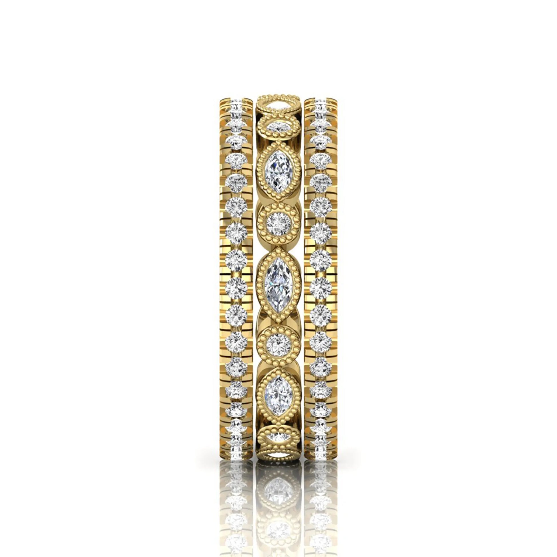 Stackable three band ring set featuring marquise and round lab grown diamonds with vintage milgrain bezels and pavé diamond bands in yellow gold
