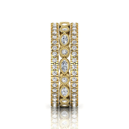 Stackable three band ring set featuring marquise and round lab grown diamonds with vintage milgrain bezels and pavé diamond bands in yellow gold