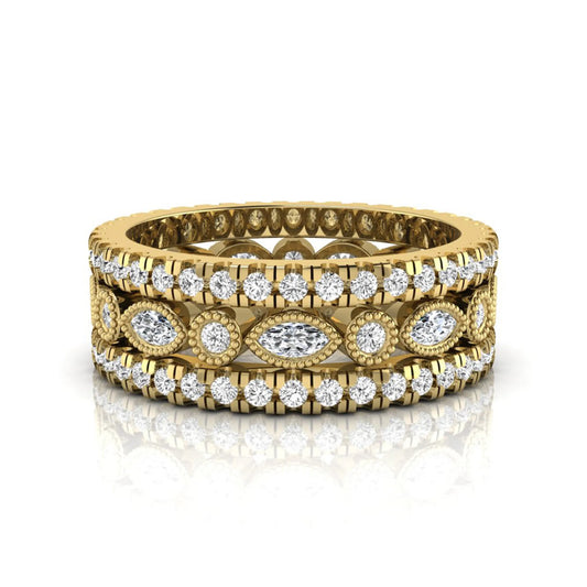 Stackable three band ring set featuring marquise and round lab grown diamonds with vintage milgrain bezels and pavé diamond bands in yellow gold