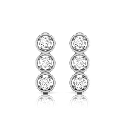 Three stone round cut lab grown diamond hoop earrings featuring bezel-inspired four prong settings, vertical diamond arrangement, hinged snap closure, and white gold tone.