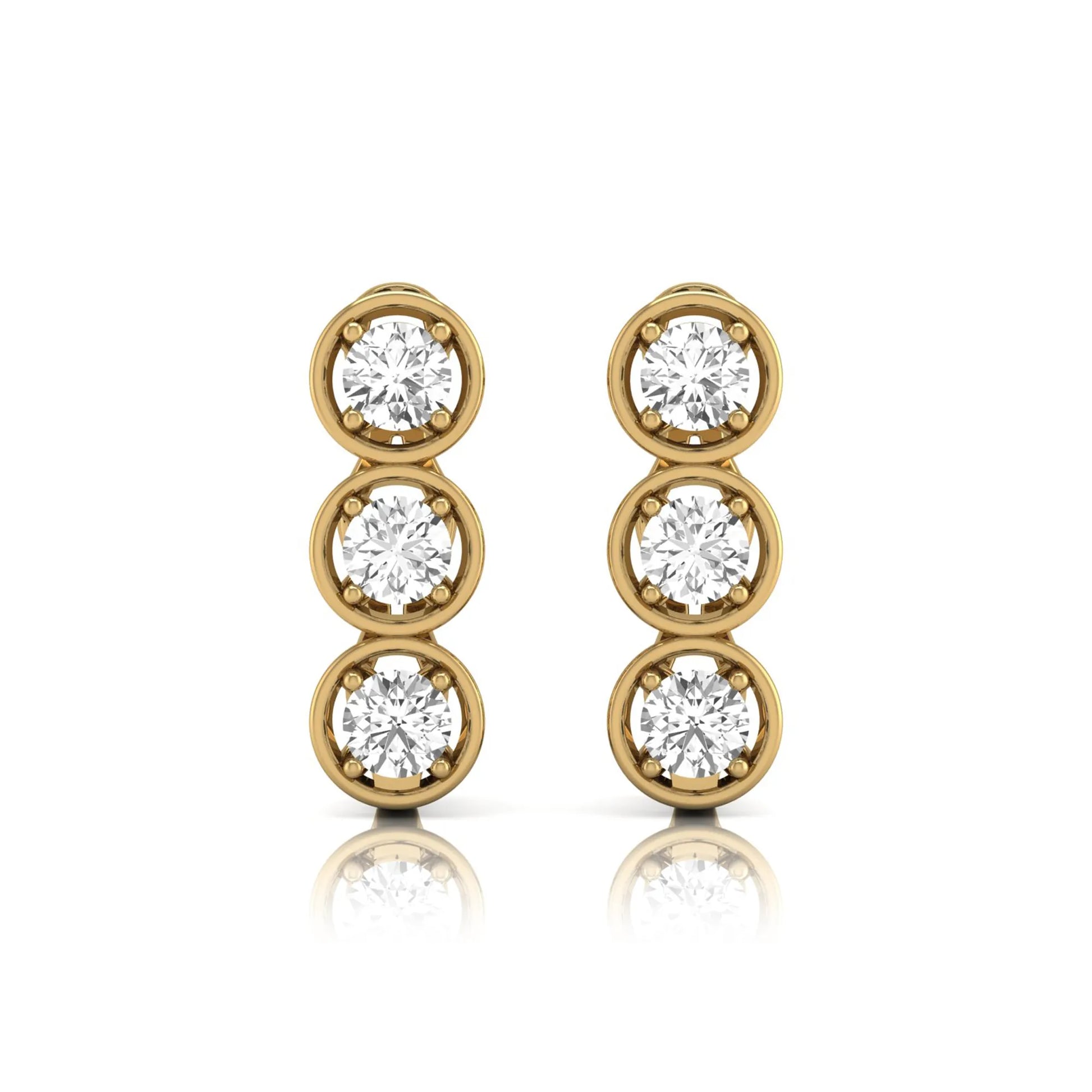 Three stone round cut lab grown diamond hoop earrings featuring bezel-inspired four prong settings, vertical diamond arrangement, hinged snap closure, and yellow gold tone.