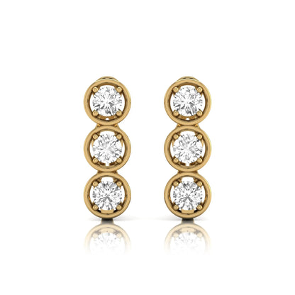 Three stone round cut lab grown diamond hoop earrings featuring bezel-inspired four prong settings, vertical diamond arrangement, hinged snap closure, and yellow gold tone.