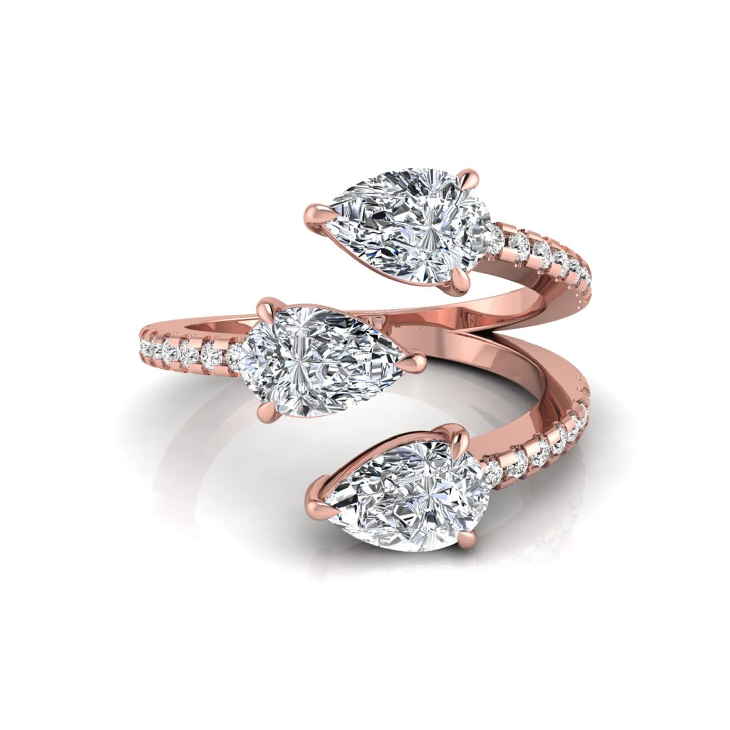 Three stone pear cut lab grown diamond wrap ring featuring round diamond accents and pavé shoulders in polished rose gold.