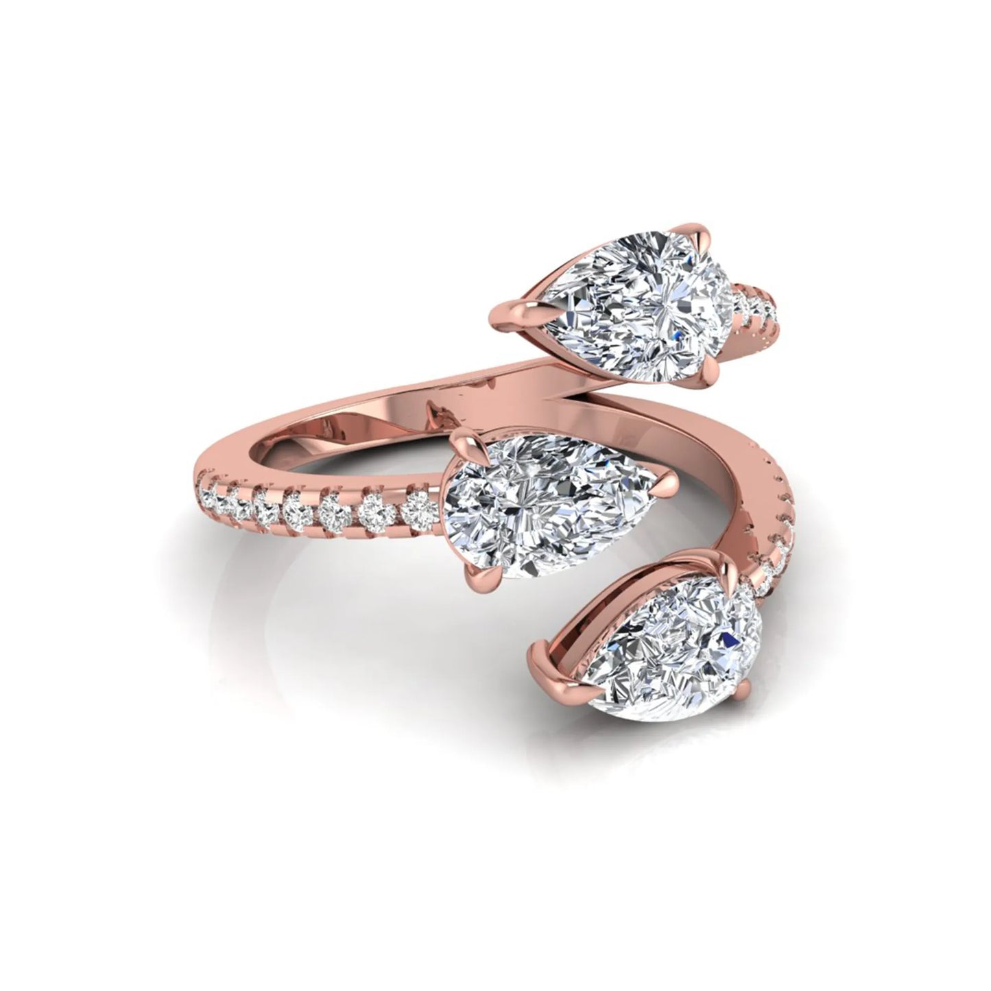 Three stone pear cut lab grown diamond wrap ring featuring round diamond accents and pavé shoulders in polished rose gold.