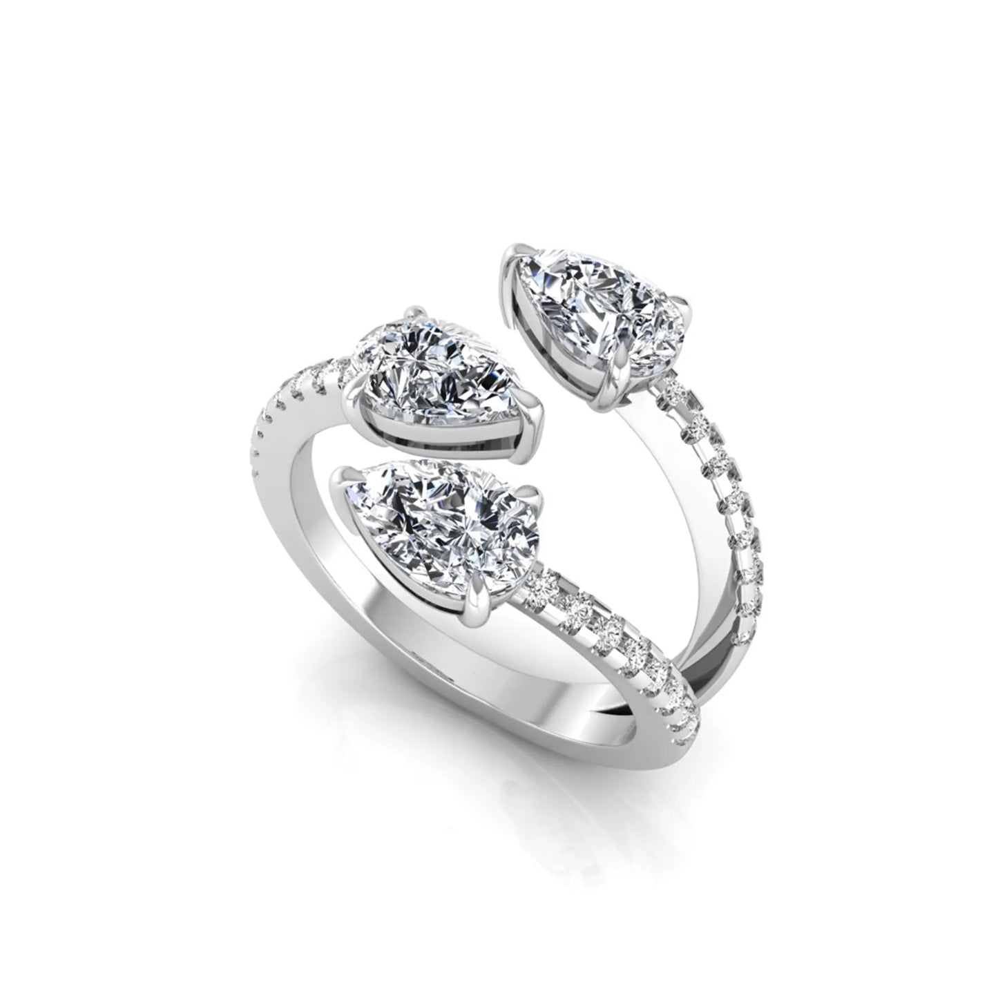 Three stone pear cut lab grown diamond wrap ring featuring round diamond accents and pavé shoulders in polished white gold.
