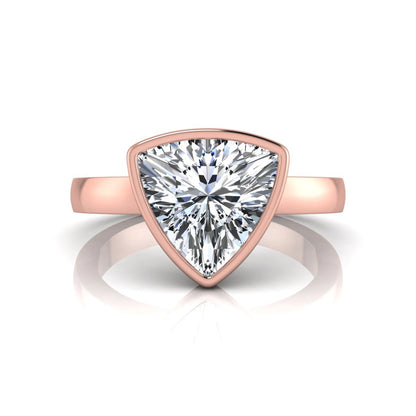 Trillion cut lab grown diamond bezel solitaire engagement ring in rose gold with IGI certified center diamond.