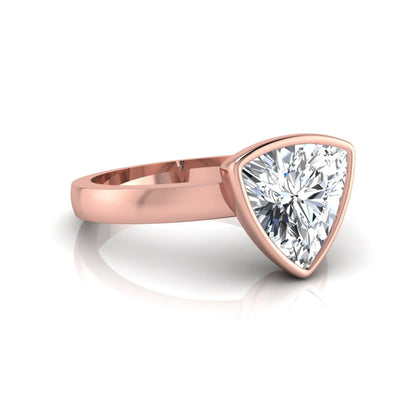 Trillion cut lab grown diamond bezel solitaire engagement ring in rose gold with IGI certified center diamond.
