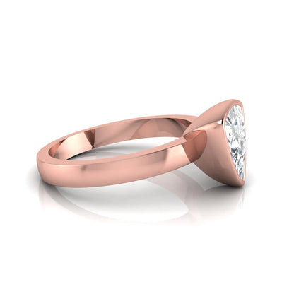Trillion cut lab grown diamond bezel solitaire engagement ring in rose gold with IGI certified center diamond.