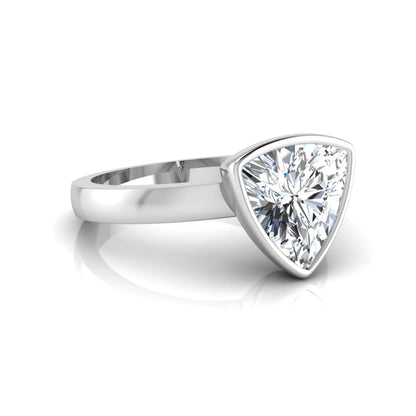 Trillion cut lab grown diamond bezel solitaire engagement ring in white gold with IGI certified center diamond.