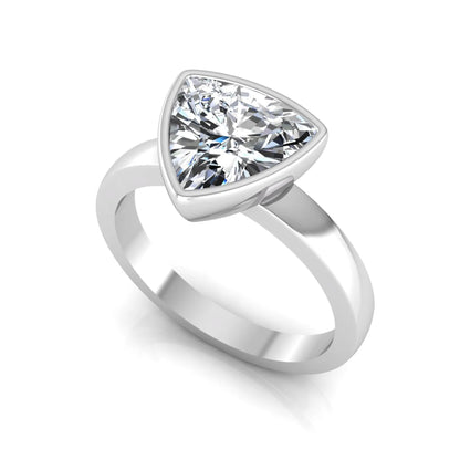 Trillion cut lab grown diamond bezel solitaire engagement ring in white gold with IGI certified center diamond.