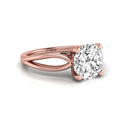 Rose-gold ring with a large diamond on a white background