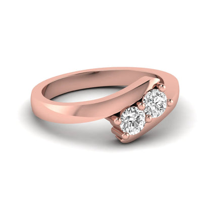 Two stone round cut lab grown diamond bypass ring featuring a graceful crossover rose gold band