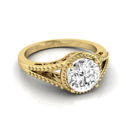 Vintage bezel round lab grown diamond engagement ring featuring a 2.04 carat IGI certified round brilliant diamond with intricate milgrain detailing in yellow gold