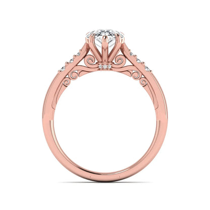 Vintage pear cut lab grown diamond engagement ring featuring an IGI certified center diamond, round diamond accents, and an ornate scroll gallery in rose gold.