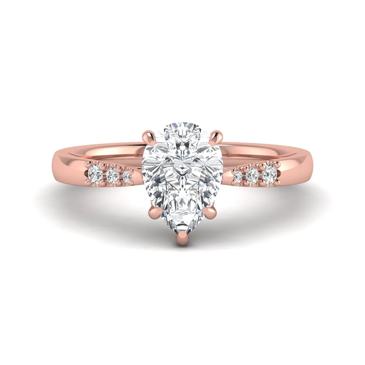 Vintage pear cut lab grown diamond engagement ring featuring an IGI certified center diamond, round diamond accents, and an ornate scroll gallery in rose gold.