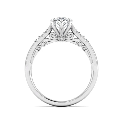 Vintage pear cut lab grown diamond engagement ring featuring an IGI certified center diamond, round diamond accents, and an ornate scroll gallery in white gold.