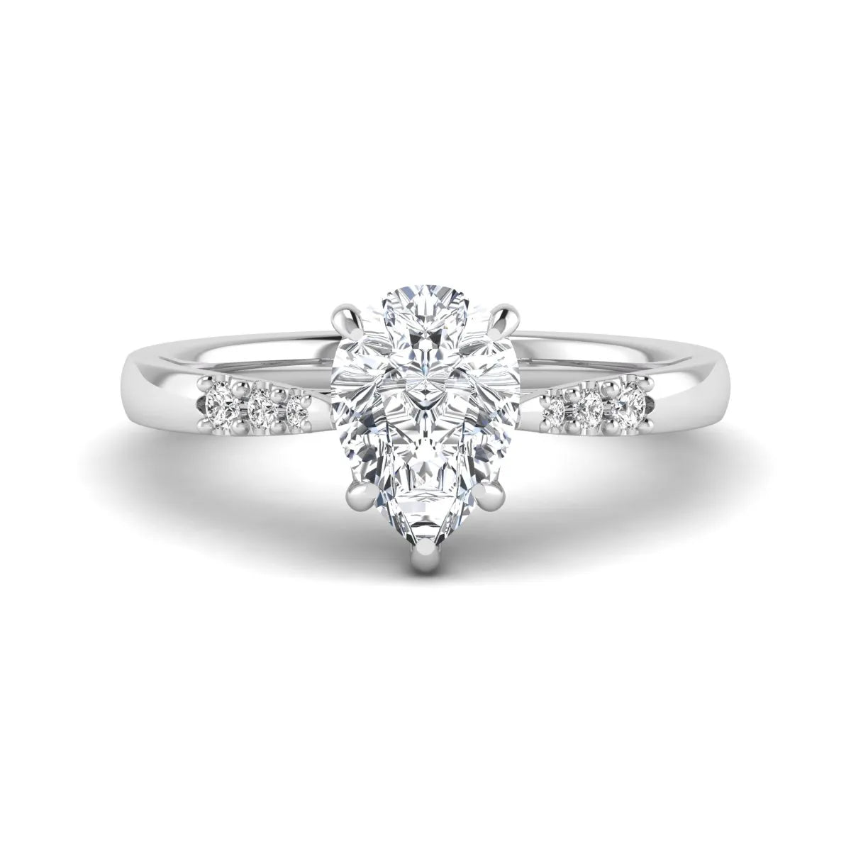 Vintage pear cut lab grown diamond engagement ring featuring an IGI certified center diamond, round diamond accents, and an ornate scroll gallery in white gold.